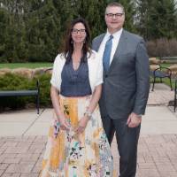 Award winner poses with wife (outdoors)
